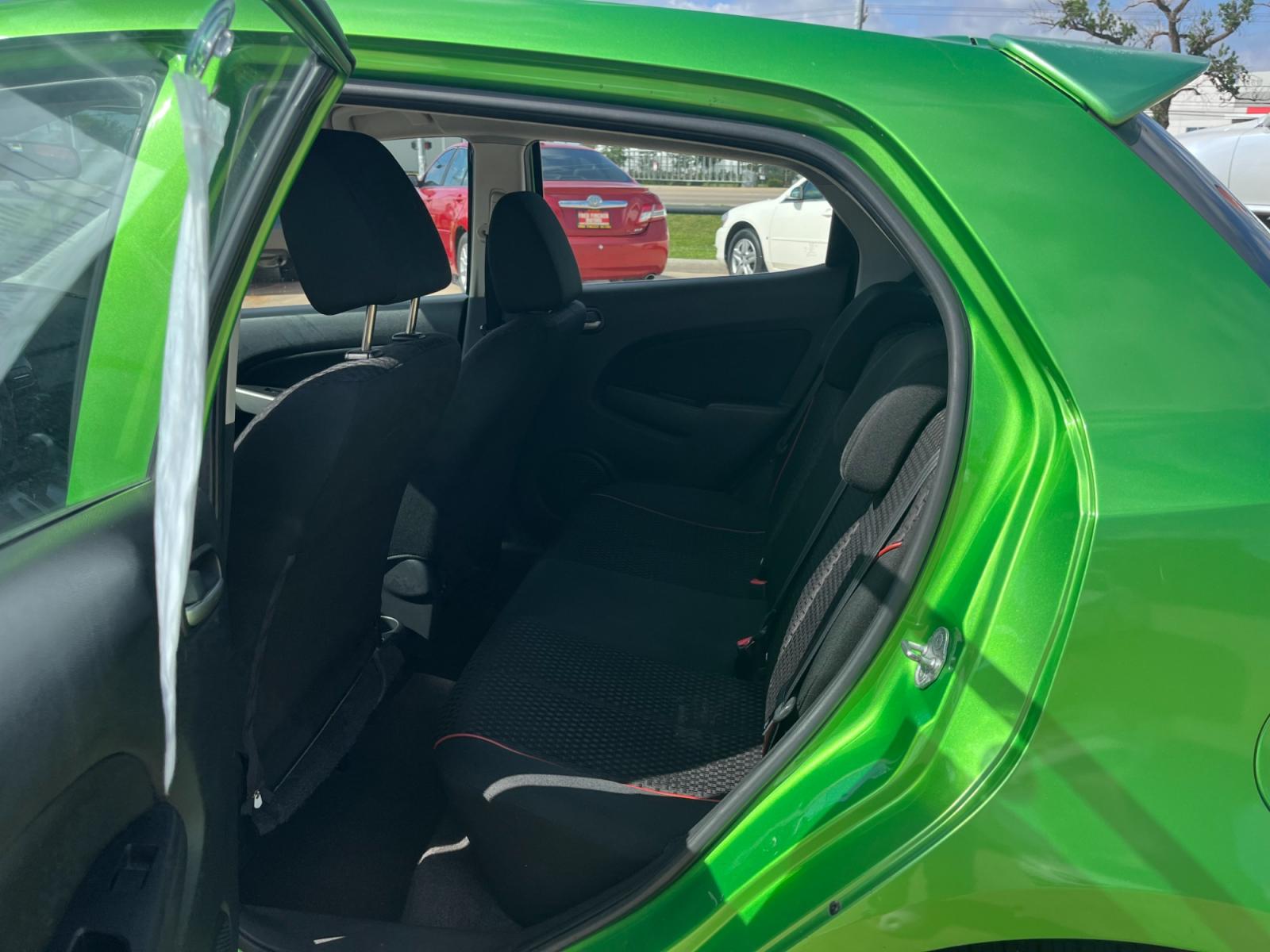 2013 green /black Mazda MAZDA2 Touring (JM1DE1LY1D0) with an 1.5L L4 DOHC 16V engine, Automatic transmission, located at 14700 Tomball Parkway 249, Houston, TX, 77086, (281) 444-2200, 29.928619, -95.504074 - Photo #9